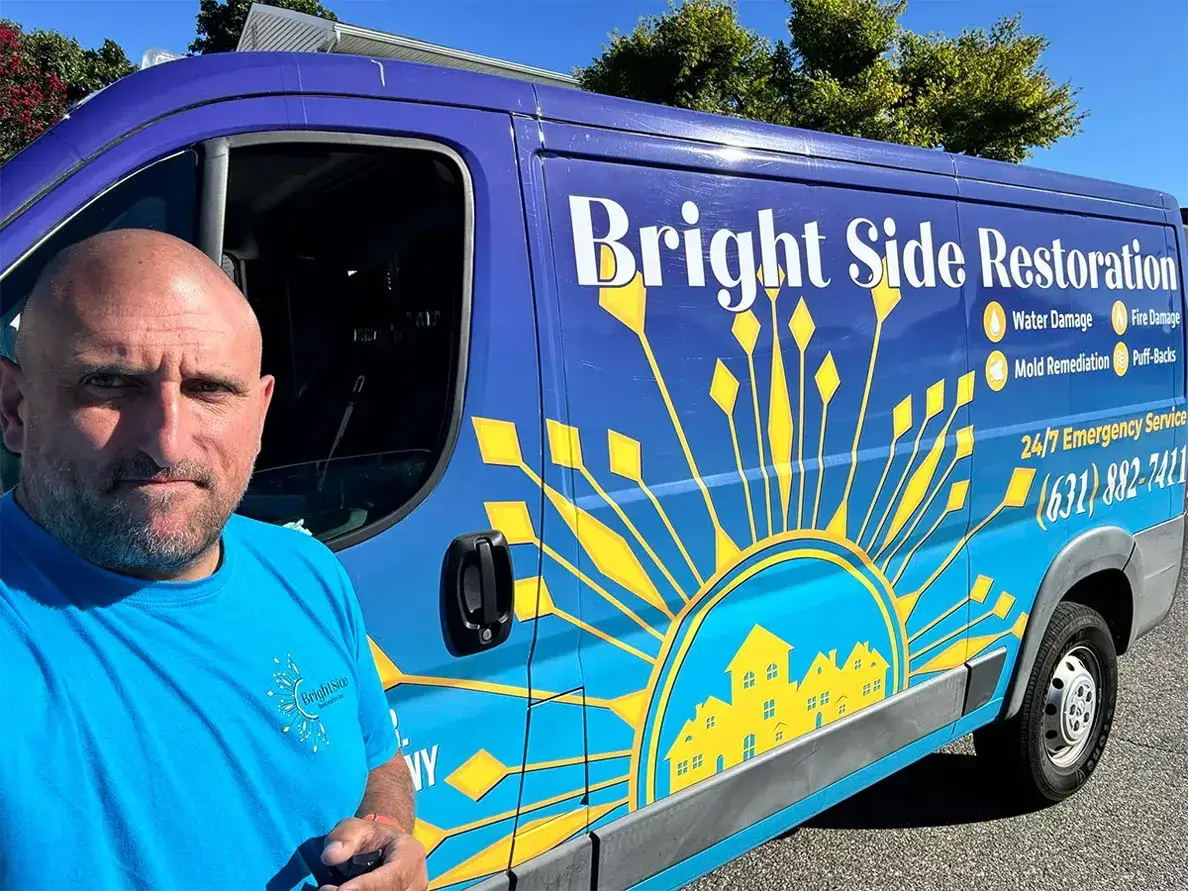 Ryan infront of bright side restoration work van